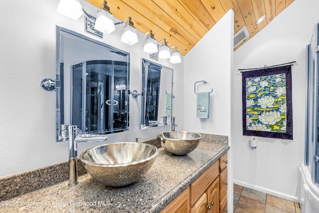 180 Ridge Rd, Gunnison, CO 81230 - full bathroom featuring wooden ceiling, double vanity, baseboards, lofted ceiling, and stone finish floors