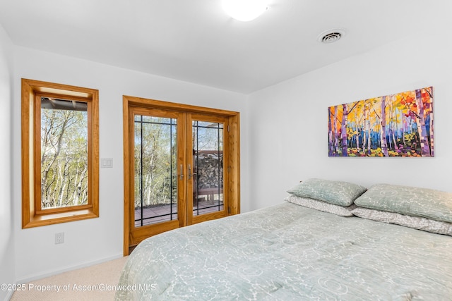 180 Ridge Rd, Gunnison, CO 81230 - carpeted bedroom with access to outside, french doors, and baseboards