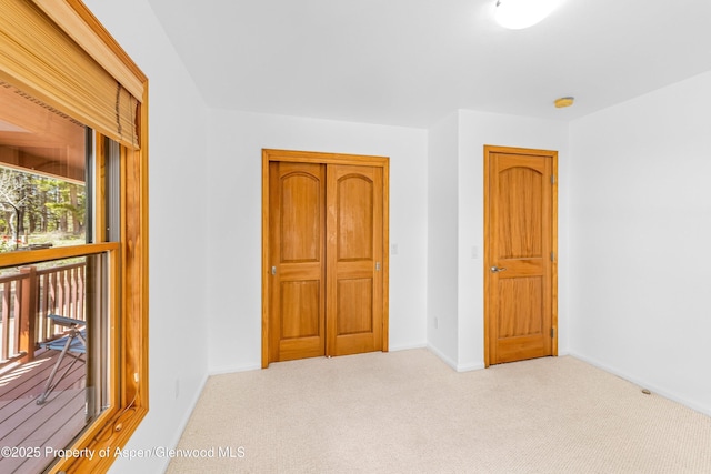 180 Ridge Rd, Gunnison, CO 81230 - unfurnished bedroom with carpet, baseboards, and a closet