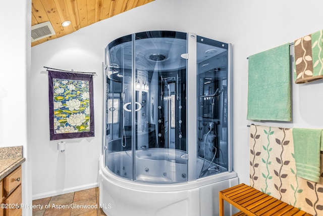 180 Ridge Rd, Gunnison, CO 81230 - bathroom with baseboards, vanity, a combined bath / shower with jetted tub, and wooden ceiling