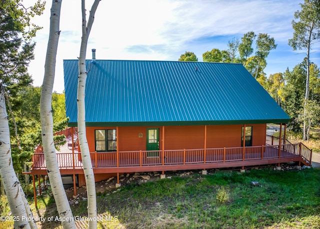 180 Ridge Rd, Gunnison, CO 81230 - view of front of house featuring metal roof and a front lawn