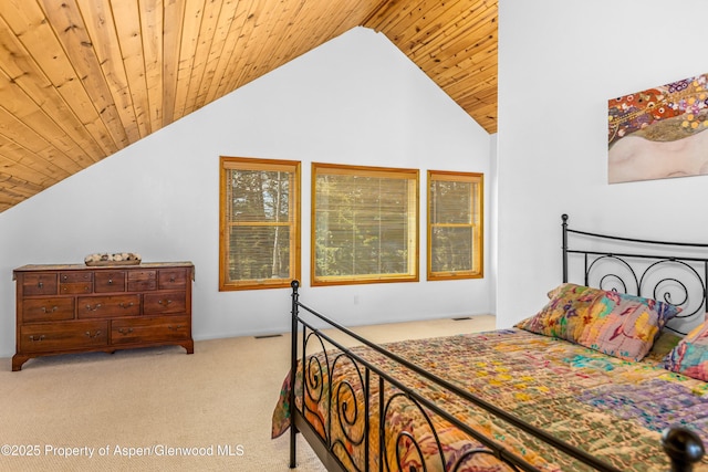 180 Ridge Rd, Gunnison, CO 81230 - carpeted bedroom with lofted ceiling and wood ceiling