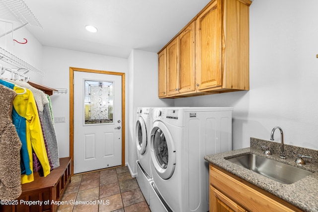 180 Ridge Rd, Gunnison, CO 81230 - washroom with washer and clothes dryer, cabinet space, dark stone finish flooring, and baseboards