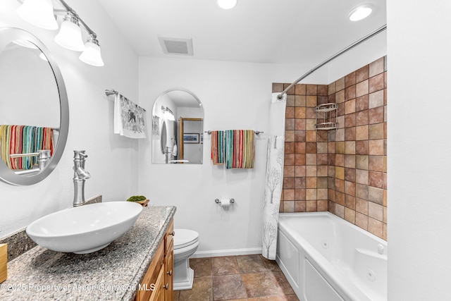 180 Ridge Rd, Gunnison, CO 81230 - full bath with vanity, baseboards, toilet, and a combined bath / shower with jetted tub