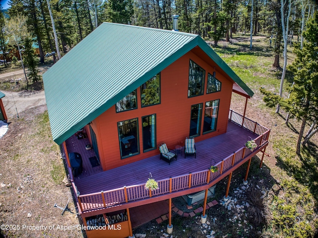 180 Ridge Rd, Gunnison, CO 81230 - rear view of house featuring a deck, metal roof, and a standing seam roof