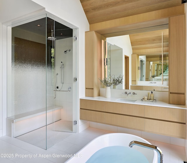 810 W Smuggler St, Aspen, CO 81611 - bathroom featuring a shower stall, lofted ceiling, a freestanding bath, vanity, and tile patterned floors