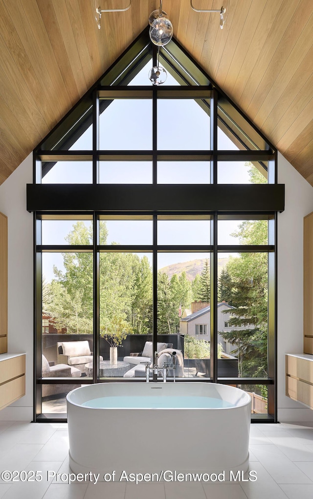 810 W Smuggler St, Aspen, CO 81611 - dining room featuring tile patterned flooring, wooden ceiling, high vaulted ceiling, and floor to ceiling windows