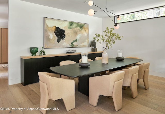 810 W Smuggler St, Aspen, CO 81611 - dining space with light wood-style flooring and a chandelier