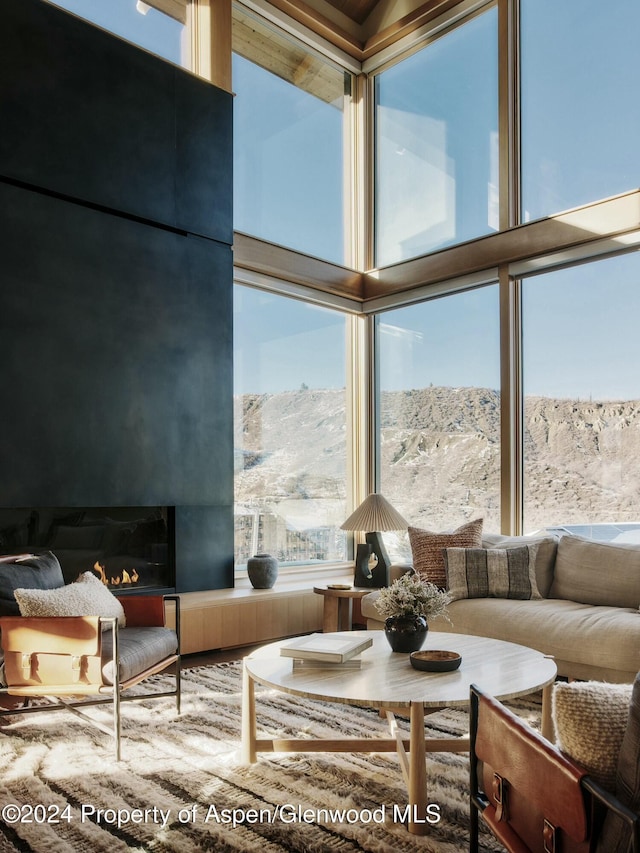 sunroom / solarium featuring a mountain view