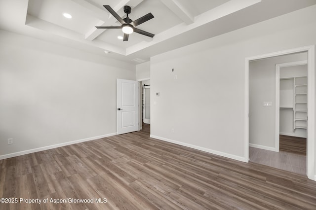 964 E 17th St, Rifle, CO 81650 - spare room with a ceiling fan, wood finished floors, beam ceiling, coffered ceiling, and recessed lighting