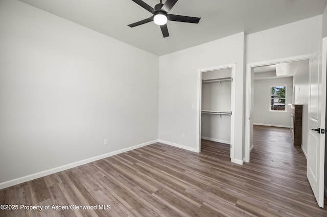 964 E 17th St, Rifle, CO 81650 - unfurnished bedroom with wood finished floors, baseboards, a closet, and ceiling fan