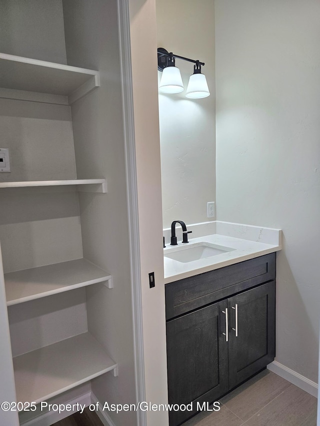 964 E 17th St, Rifle, CO 81650 - bathroom with vanity and wood finished floors