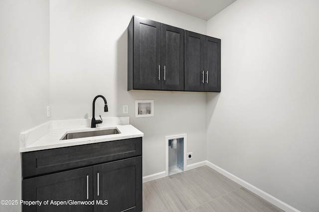 964 E 17th St, Rifle, CO 81650 - laundry area with hookup for a washing machine, cabinet space, hookup for an electric dryer, and baseboards