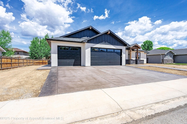 964 E 17th St, Rifle, CO 81650 - modern farmhouse featuring an attached garage, concrete driveway, board and batten siding, and stucco siding