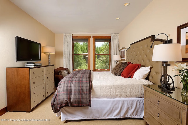 bedroom featuring light carpet and access to outside