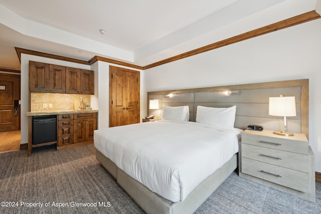 bedroom with bar and dark colored carpet