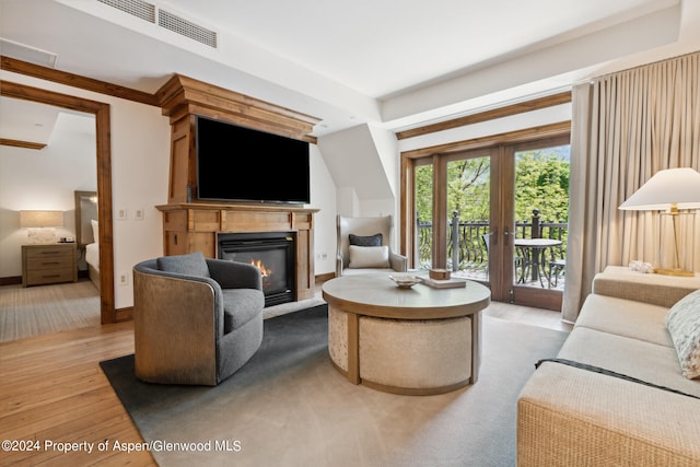 living room featuring light hardwood / wood-style flooring and french doors