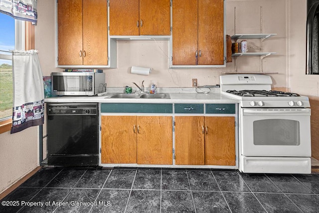 194 Hill Dr, Craig, CO 81625 - kitchen with stainless steel microwave, dishwasher, white range with gas stovetop, a sink, and open shelves