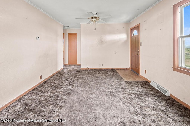 194 Hill Dr, Craig, CO 81625 - unfurnished living room with crown molding, carpet flooring, a ceiling fan, and baseboards