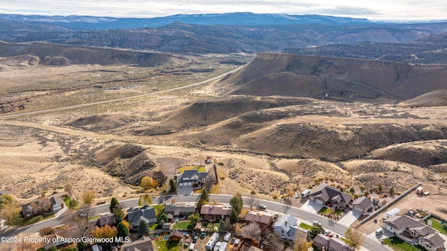 birds eye view of property featuring a mountain view