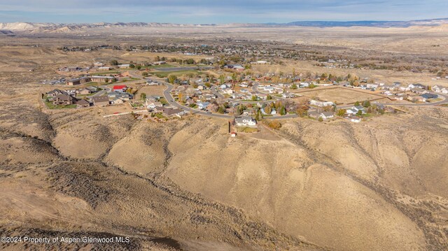 birds eye view of property with a mountain view