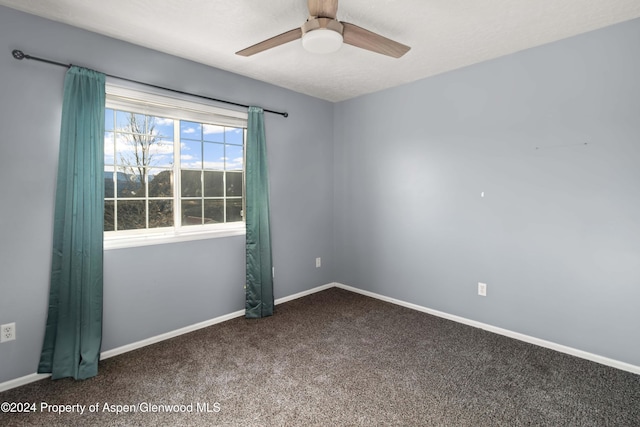 carpeted empty room with ceiling fan