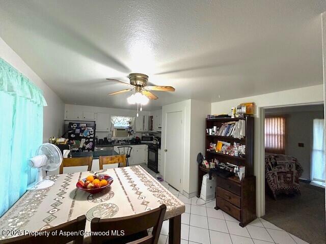 204 W 12th St, Craig, CO 81625 - dining space with ceiling fan and light tile patterned flooring