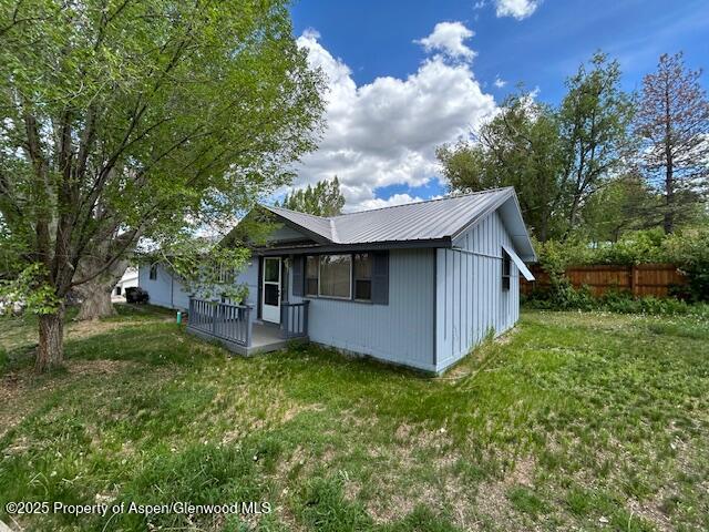 204 W 12th St, Craig, CO 81625 - view of home's exterior featuring a metal roof