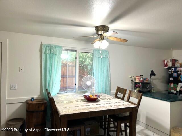 204 W 12th St, Craig, CO 81625 - dining area with a ceiling fan and light tile patterned floors
