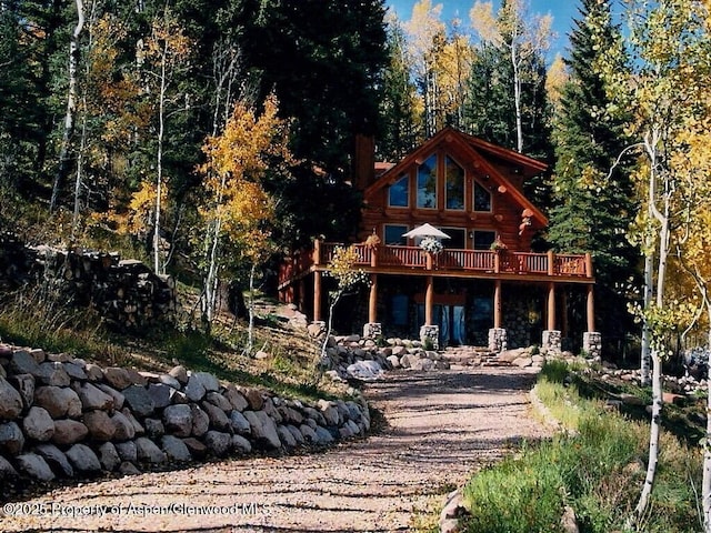 1373 Mclaughlin Ln, Basalt, CO 81621 - rear view of house with log siding and a wooden deck