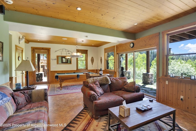 1373 Mclaughlin Ln, Basalt, CO 81621 - living room featuring billiards, wood ceiling, plenty of natural light, wood walls, and tile patterned floors