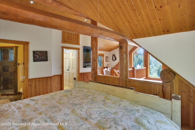 1373 Mclaughlin Ln, Basalt, CO 81621 - bedroom with wooden ceiling with exposed beams, a wainscoted wall, and wooden walls