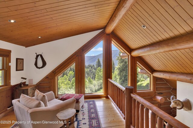 1373 Mclaughlin Ln, Basalt, CO 81621 - living area with wooden ceiling, light wood-type flooring, plenty of natural light, rustic walls, and a mountain view