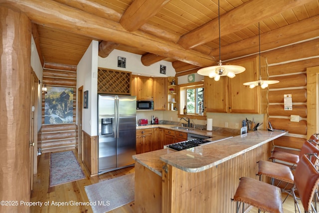 1373 Mclaughlin Ln, Basalt, CO 81621 - kitchen featuring stainless steel refrigerator with ice dispenser, black microwave, light wood-type flooring, wooden ceiling with exposed beams, and a peninsula