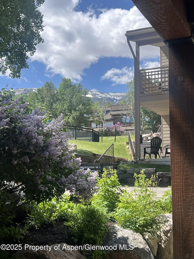 35 Campground Ln Unit E4, Snowmass Village, CO 81615 - view of yard with a balcony and a mountain view
