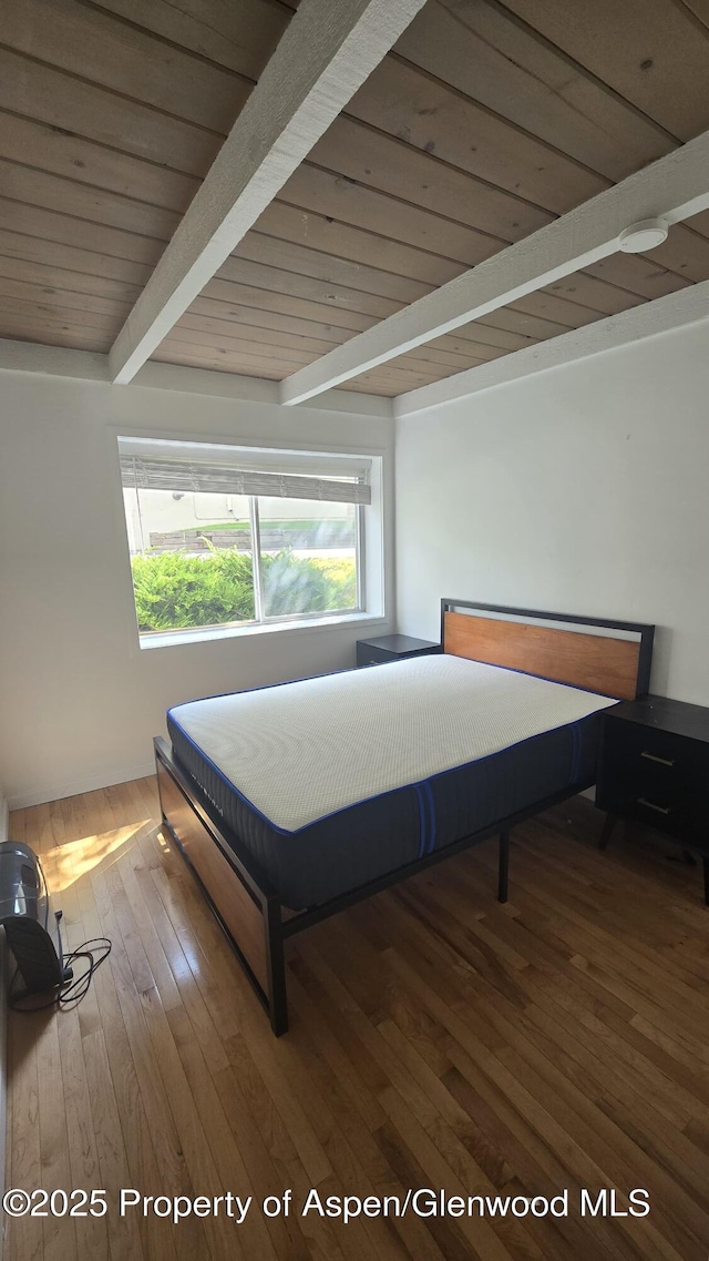 35 Campground Ln Unit E4, Snowmass Village, CO 81615 - bedroom with a wooden ceiling with exposed beams and wood finished floors