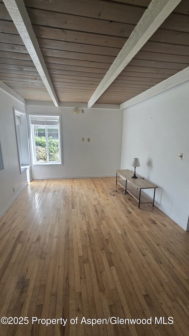 35 Campground Ln Unit E4, Snowmass Village, CO 81615 - empty room featuring hardwood / wood-style flooring and a wooden ceiling with exposed beams