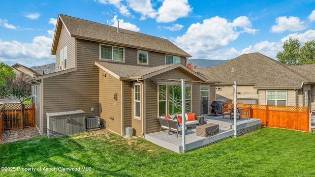 41 Red Cloud Ct, New Castle, CO 81647 - rear view of property featuring a deck, an outdoor hangout area, central AC unit, and a shingled roof