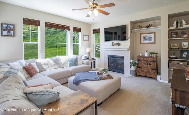 41 Red Cloud Ct, New Castle, CO 81647 - living area with ceiling fan, a fireplace, and carpet floors