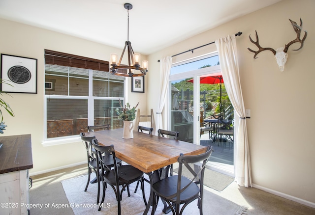 41 Red Cloud Ct, New Castle, CO 81647 - dining area with a chandelier, baseboards, and carpet floors