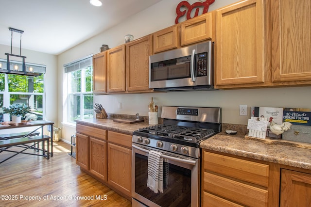 41 Red Cloud Ct, New Castle, CO 81647 - kitchen featuring stainless steel appliances, light wood-style flooring, decorative light fixtures, a chandelier, and recessed lighting