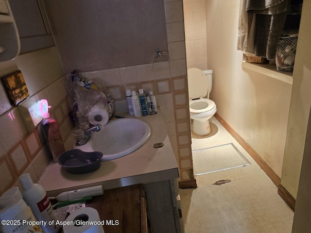 bathroom featuring toilet and vanity