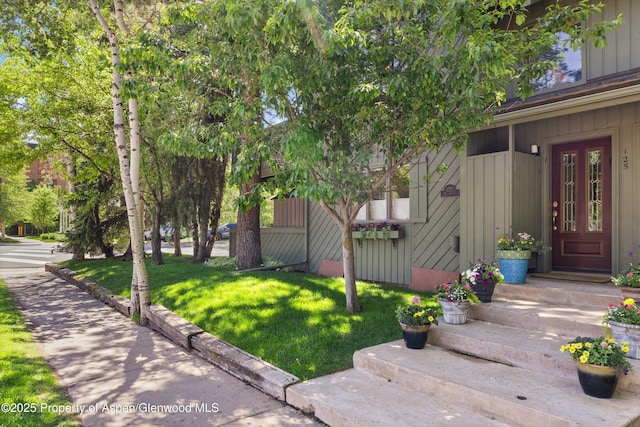 125 E Hyman Ave Unit 1A, Aspen, CO 81611 - property entrance with a yard and board and batten siding