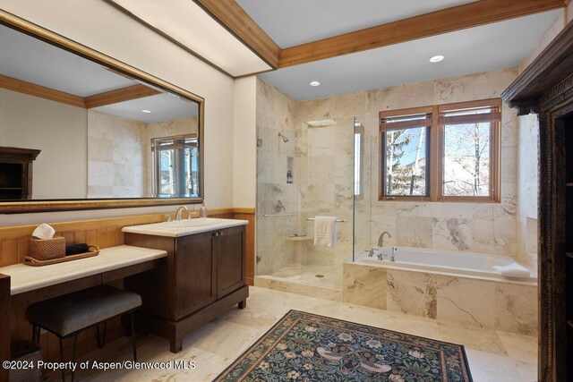 bathroom with vanity and independent shower and bath