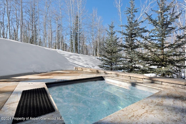 view of snow covered pool