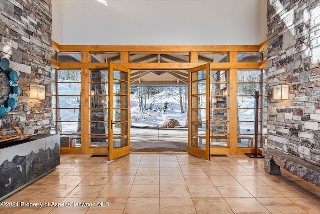 interior space featuring french doors and light tile patterned flooring