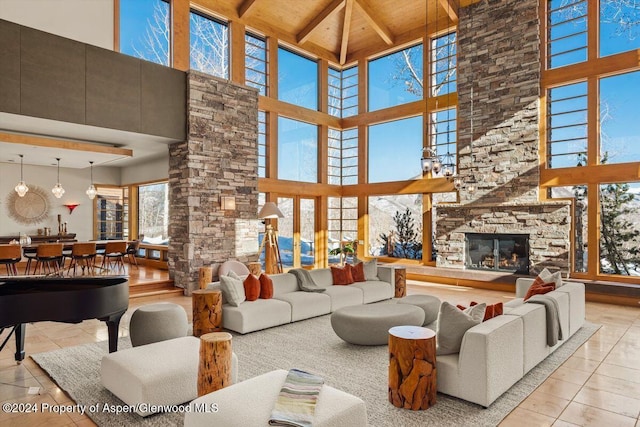 living room featuring wood ceiling, beam ceiling, light tile patterned floors, high vaulted ceiling, and a fireplace