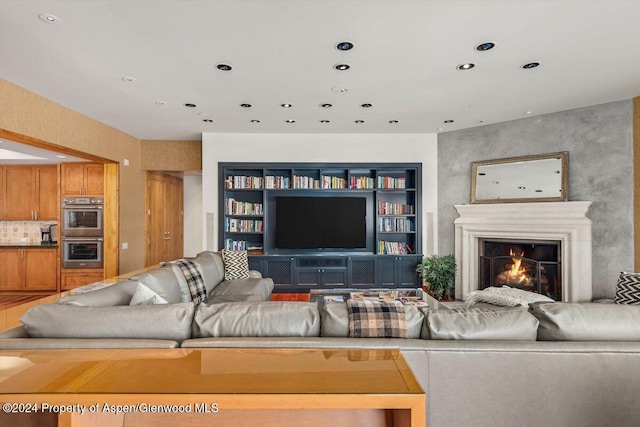 living room featuring built in shelves