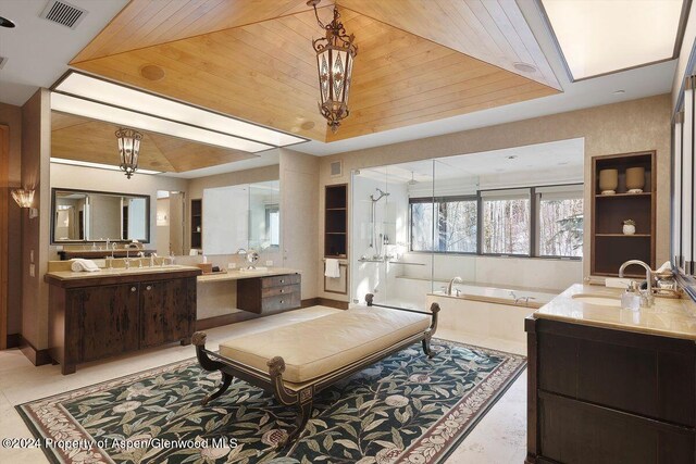 bathroom featuring tile patterned flooring, a bath, vanity, and wooden ceiling