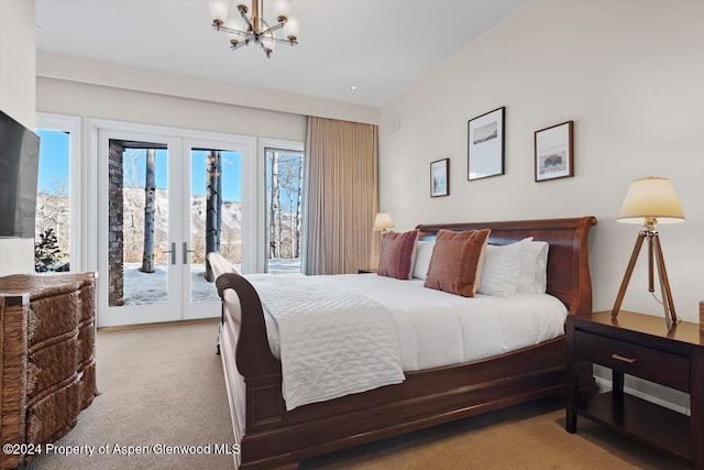 carpeted bedroom featuring a notable chandelier, access to exterior, and french doors